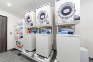 a row of washing machines in a room at MIMARU Tokyo Ginza East in Tokyo