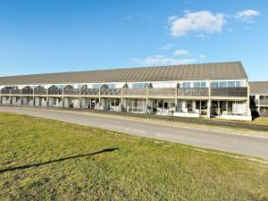 a large building with a road in front of it at Holiday Home Golfvejen VII in Fanø