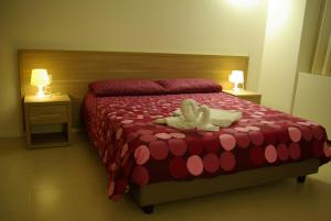 San Luigi - Residenza Gemelli tesisinde bir odada yatak veya yataklar