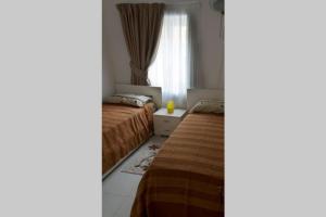 Säng eller sängar i ett rum på Luxurious Furnished apartment in sliema
