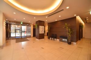 a lobby of a building with a circular ceiling at Dormy Inn Tomakomai in Tomakomai