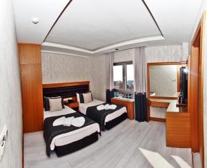 En eller flere senge i et værelse på Grand Emir Hotel Old City + 42 billeder