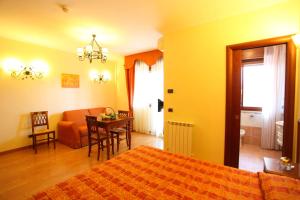 Voodi või voodid majutusasutuse Altea Suites toas