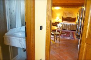 Postel nebo postele na pokoji v ubytování Locanda Ristorante Gavarini