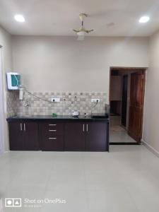 a kitchen with a counter and a ceiling at Guesthouse Sakina Colva in Colva +97 photos