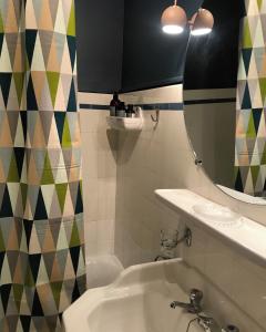 a bathroom with a sink and a mirror at L’Appartement des Glières Annecy centre in Annecy