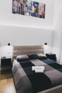 A bed or beds in a room at Terno su Napoli