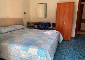 Postel nebo postele na pokoji v ubytování Hotel Europa