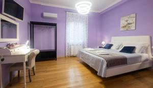Postel nebo postele na pokoji v ubytování LE STANZE DI LUCA + 9 fotografií