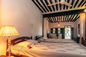 Cama o camas de una habitación en Kijani Hotel