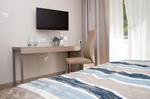 Łóżko lub łóżka w pokoju w obiekcie Villa Bravo & SPA
