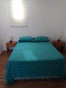 Ένα ή περισσότερα κρεβάτια σε δωμάτιο στο Hermosas habitaciones para 1 - 2 o 4 personas