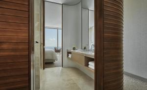a bathroom with a large mirror and a tub at Four Seasons Hotel Philadelphia at Comcast Center in Philadelphia