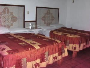 Ліжко або ліжка в номері Hotel Albatros