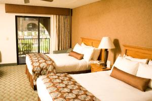 a hotel room with two beds and a balcony at Borrego Springs Resort and Spa in Borrego Springs