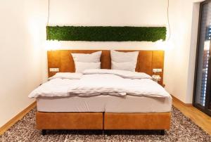 Postel nebo postele na pokoji v ubytování IchZeit Aparthotel