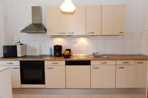 Kuchyň nebo kuchyňský kout v ubytování Sea view apartment Manda