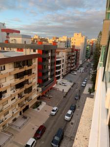 an aerial view of a city street with buildings at Excelente apt para veraneio c Wi-Fi tv e box in Capão da Canoa