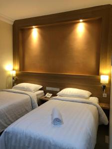 Postel nebo postele na pokoji v ubytování LCR HOTEL