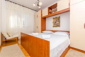 Posteľ alebo postele v izbe v ubytovaní Apartment Buksa