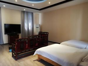 Un ou plusieurs lits dans un hébergement de l'établissement 7 Sages International Youth Hostel Xi'an