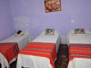 Tempat tidur dalam kamar di La Posada de Bartola