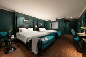Voodi või voodid majutusasutuse Grande Collection Hotel & Spa toas