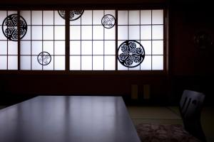 a window with a bench in front of it at Hitomaru Kadan in Akashi +9 photos