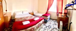 Voodi või voodid majutusasutuse Harbourview Stadium Hotel toas