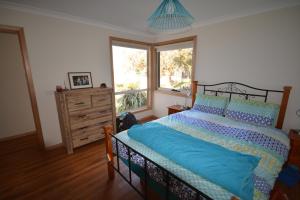 Llit o llits en una habitació de Seascape Beach House