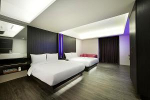 Letto o letti in una camera di Seven Fukun Hotel