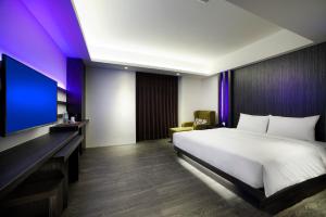 Letto o letti in una camera di Seven Fukun Hotel