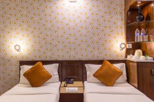 Uma cama ou camas num quarto em Dahlia Boutique Hotel