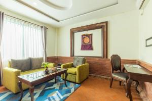 Uma área de estar em Dahlia Boutique Hotel