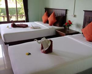 A bed or beds in a room at Veranda Lanta Resort