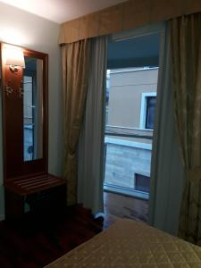 Llit o llits en una habitació de Hotel San Michele