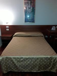 Lova arba lovos apgyvendinimo įstaigoje Hotel San Michele