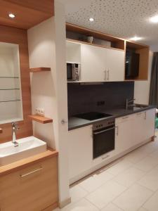 A kitchen or kitchenette at Apart welcom