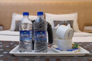 Postel nebo postele na pokoji v ubytování Rupam Hotel