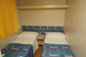 Postel nebo postele na pokoji v ubytování Camping Terrazzo sul mare