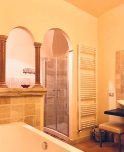 a bathroom with a shower and a bath tub at Casa Vannucci in Perugia
