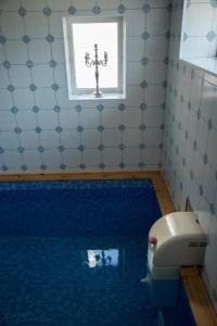 
Ванная комната в Гостевой дом Le Chalet
