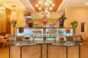 Restoranas ar kita vieta pavalgyti apgyvendinimo įstaigoje Millennium Executive Apartments Salalah
