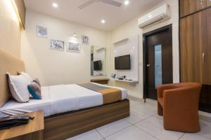 Postel nebo postele na pokoji v ubytování Rupam Hotel