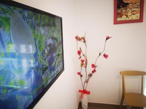 TV a/nebo společenská místnost v ubytování Via Roma