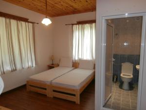 Säng eller sängar i ett rum på Hotel Mitnitsa and TKZS Biliantsi