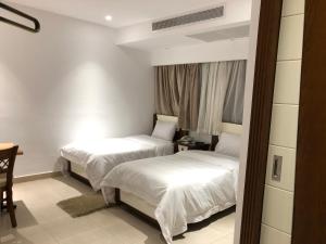 Voodi või voodid majutusasutuse Maxim Hotel toas