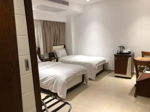 Voodi või voodid majutusasutuse Maxim Hotel toas