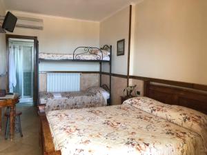 Postel nebo postele na pokoji v ubytování Agriturismo La Baita