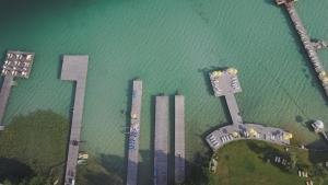 an overhead view of a body of water with tall buildings at Pension Christiane in Sankt Kanzian